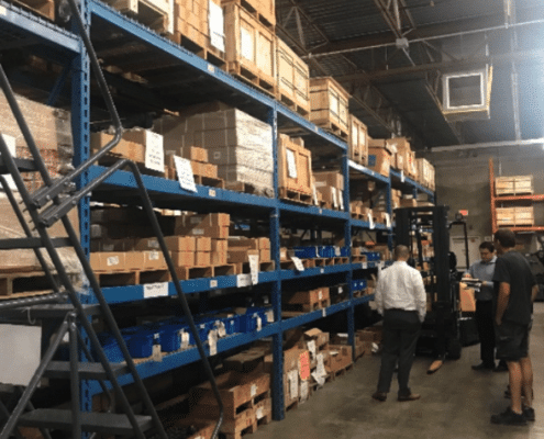 project managers overseeing warehouse layout alteration