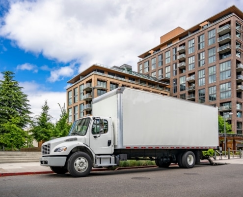 commercial relocation project management company using a plain white moving truck to relocate a business