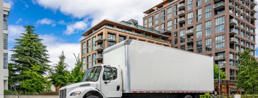 commercial relocation project management company using a plain white moving truck to relocate a business